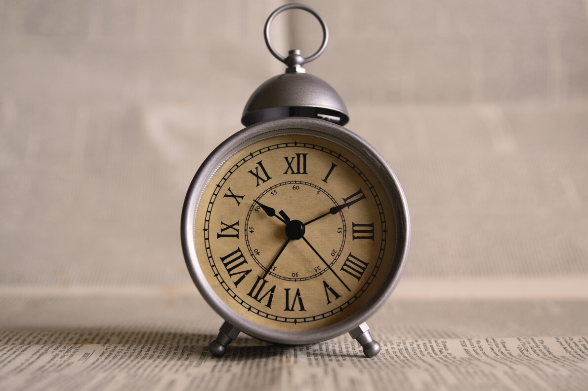 Old alarm clock with Roman numerals
