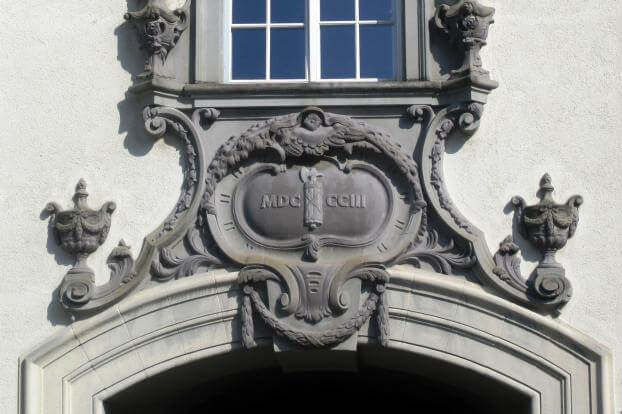 Date MDCCCIII (1803) inscribed in Roman numerals on a building facade