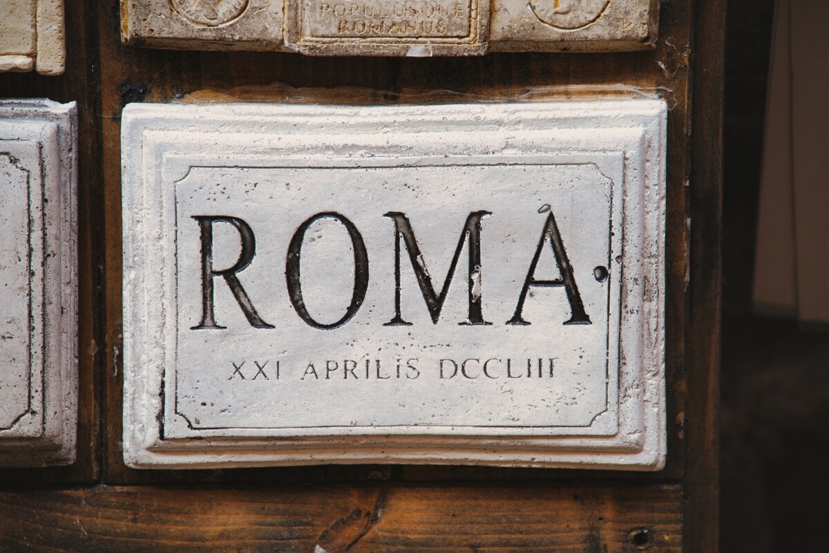 Historical Roman plaque displaying ROMA inscription with date in Roman numerals XXI APRILIS DCCLIII